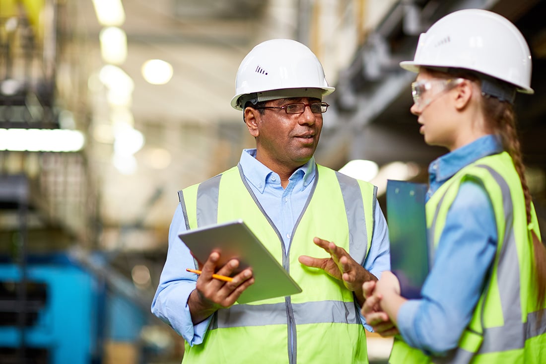 blue-collar-workers-holding-tablet